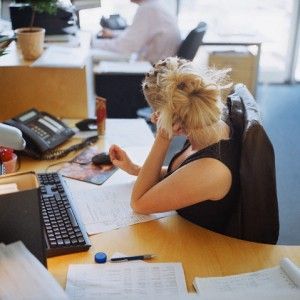 Bored Woman Sitting at Her Desk